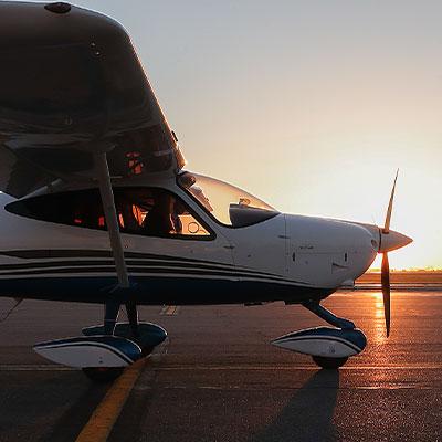 Student in plane on runway